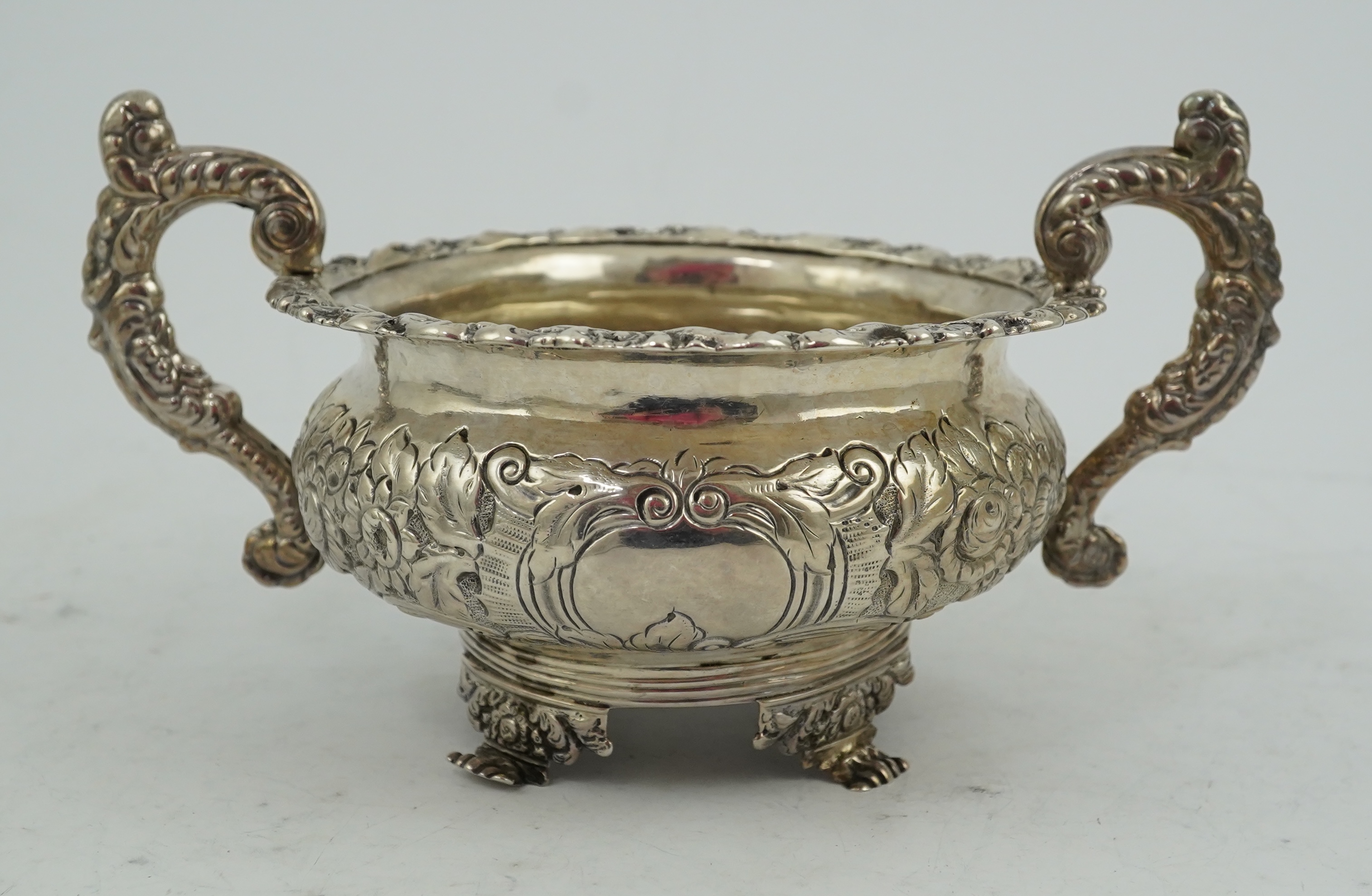 A George IV Irish embossed silver two handled sugar bowl, by James Scott